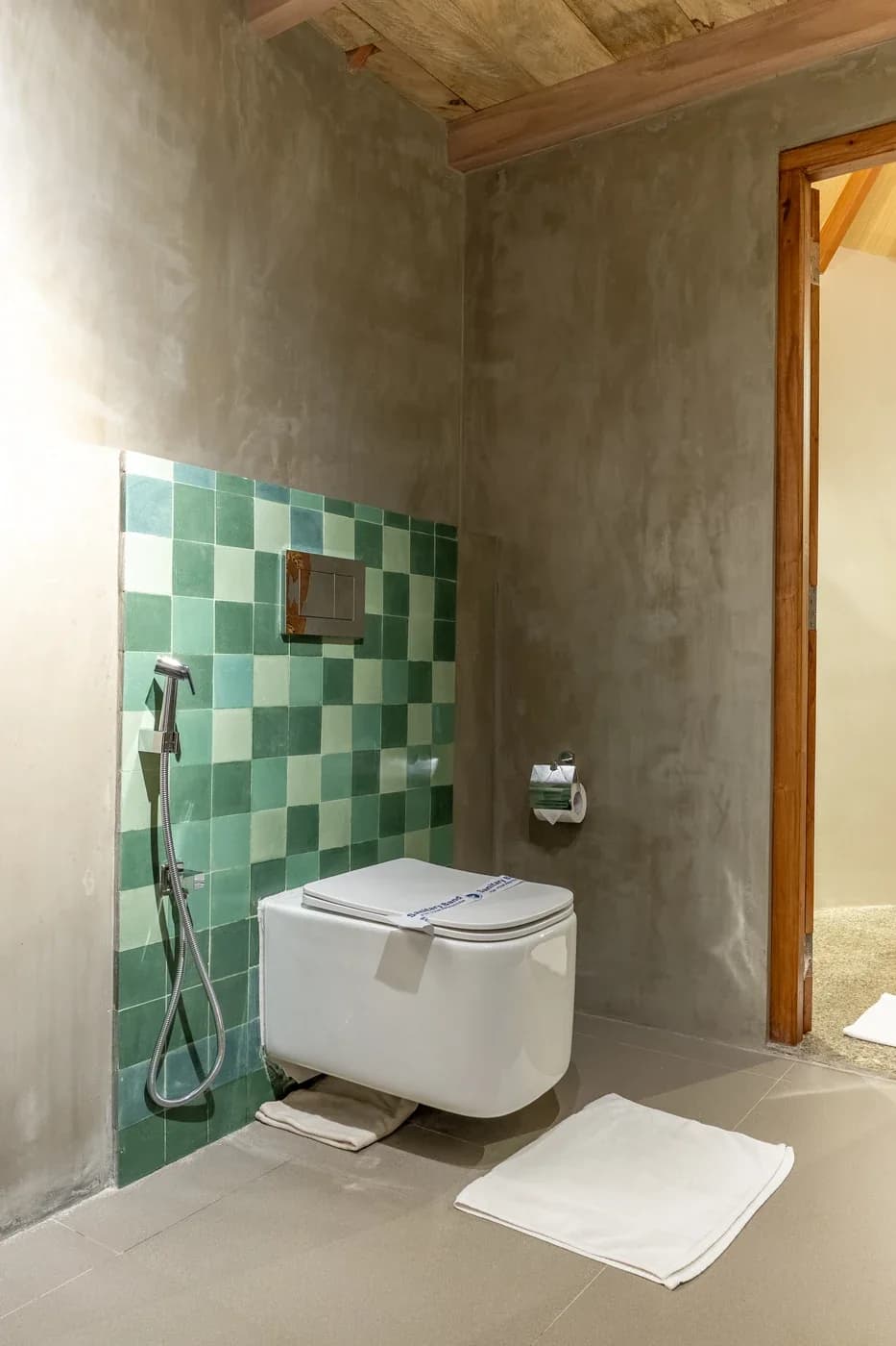 Tranquil Trails guest bathroom with handcrafted green tiles